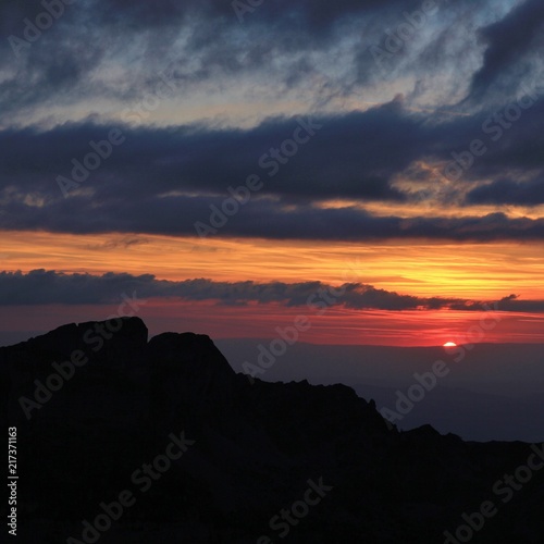 Colorful sunset over Mount Sigriswiler Rothorn. View from Mount Niederhorn, Switzerland.