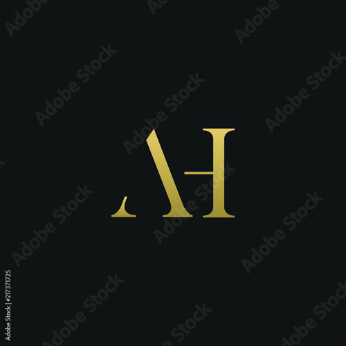 Creative modern elegant AH black and gold color initial based letter icon logo. photo