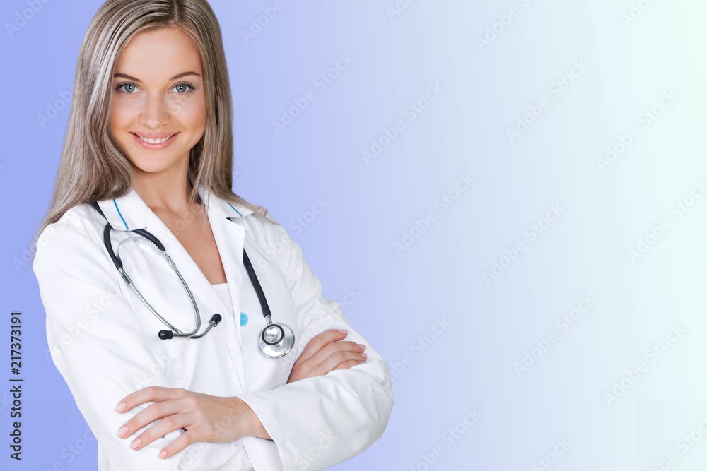 Attractive young female doctor with blurred hospital Attractive young female doctor with blurred hospital