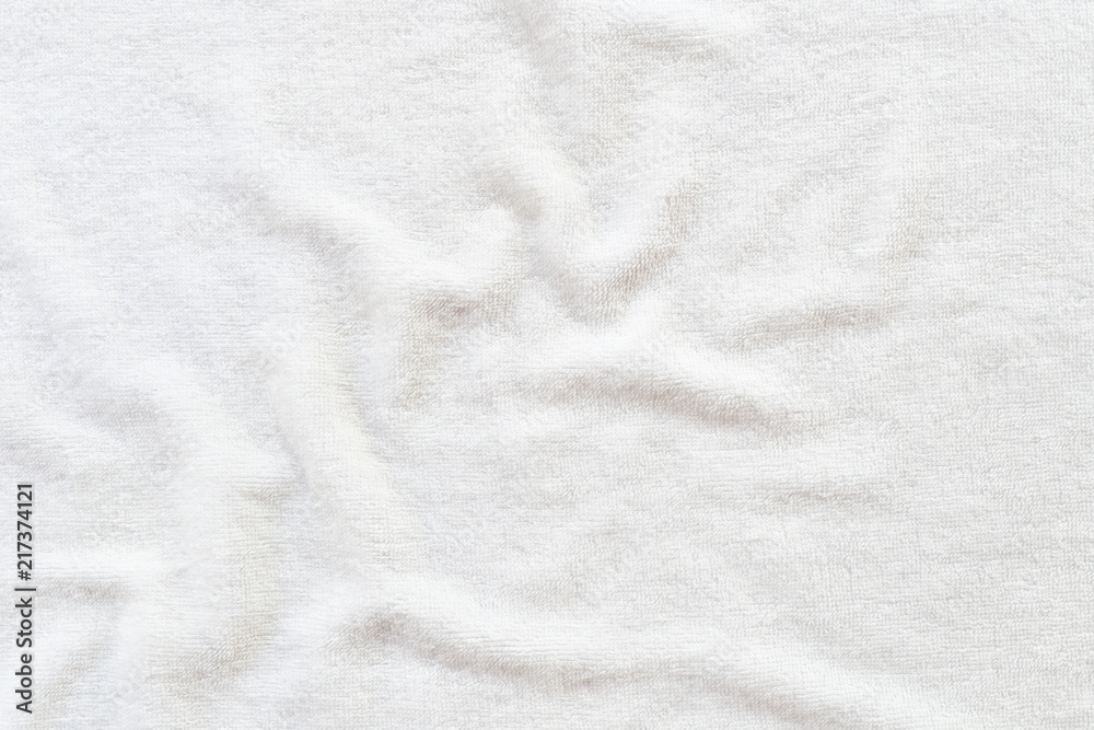 White towel texture background with abstract pattern. That fabric or textile consist of cotton fiber or natural material. For absorb water, drying and wiping in bathroom, laundry and kitchen room.