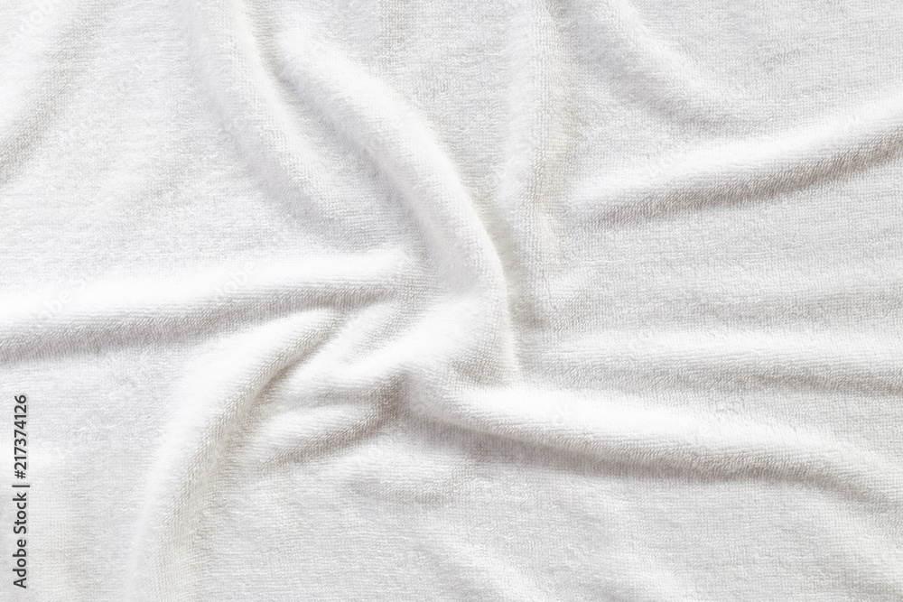 White towel texture for background. That fabric or textile consist of cotton fiber material. Look plush, fluffy, dry, soft and clean. For background about baby, spa, hotel, laundry and hygiene etc.