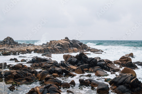 Waves crashing on the rocks at Gwangjin beach in Yangyang, Gangwon-do, Korea photo