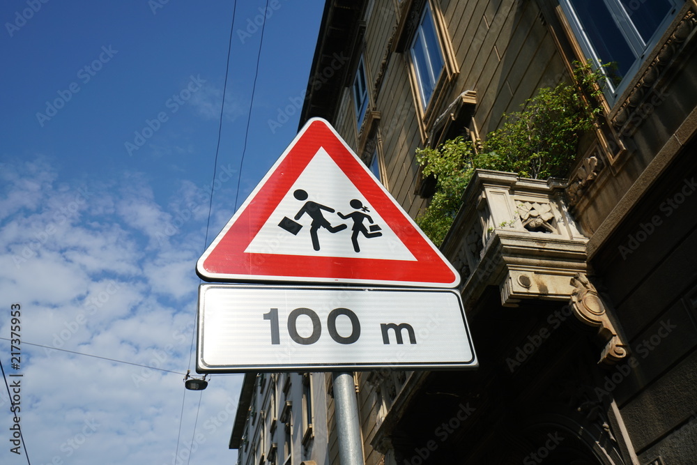 Milan,Italy-July 24, 2018: Warning road sign of Children, a road sign near Chiesa di Santa Maria delle Grazie, Milan