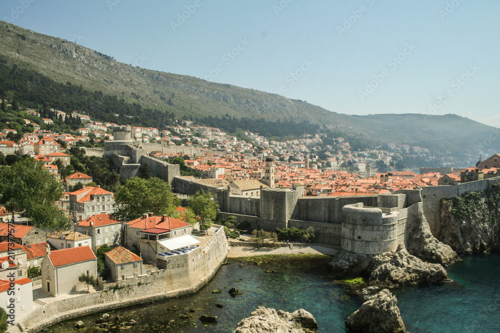 Great Walls of the Old town of Dubrovnik, Croatia, seen from above with the Adriatic see in the background. The place is one of the major hotspots for Croatian tourism..