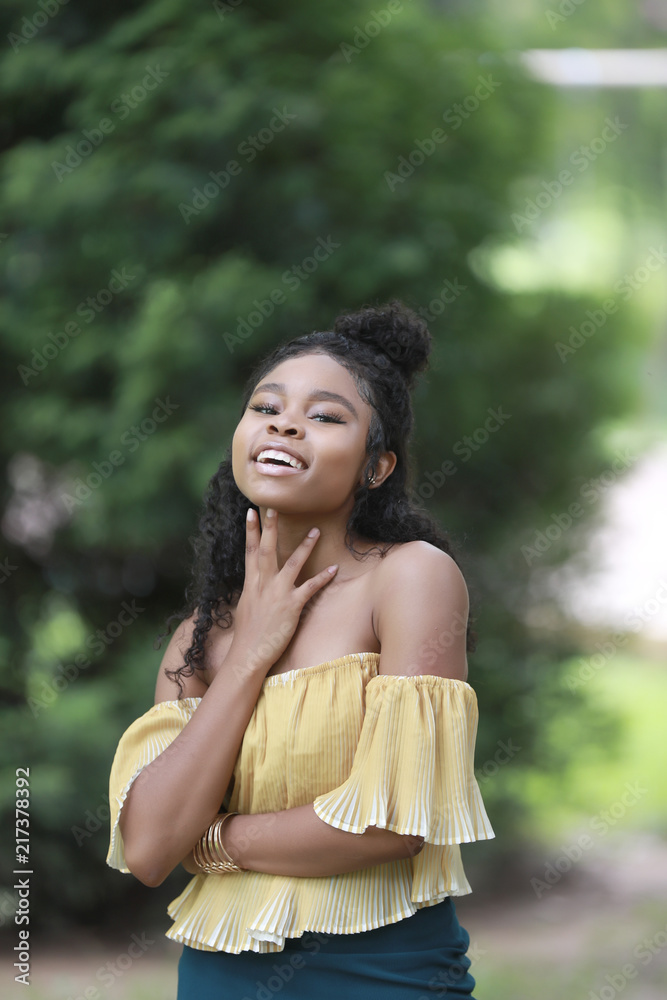 Charming laughing black woman posing at camera Charming laughing black woman posing at camera