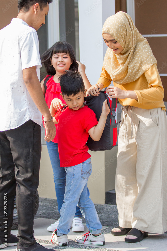 Fototapeta premium boy and girl wearing backpack
