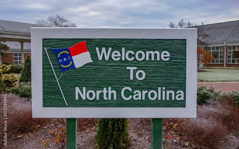 Welcome to North Carolina Sign on Tourist Visitor center background. Welcome to North Carolina Sign on Tourist Visitor center background.