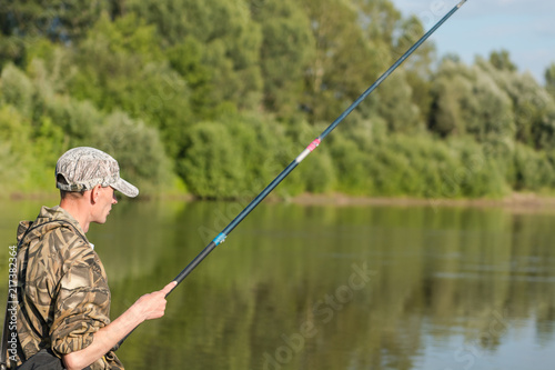 To fish with a fishing rod on the lake