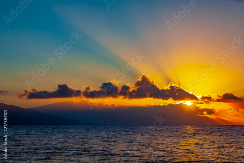 sunrise with clouds on ocean