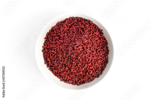 Red yeast fermented rice on white plate