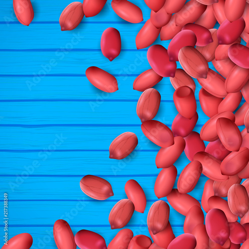 Arachis or peanuts background with red scattered nuts and beans