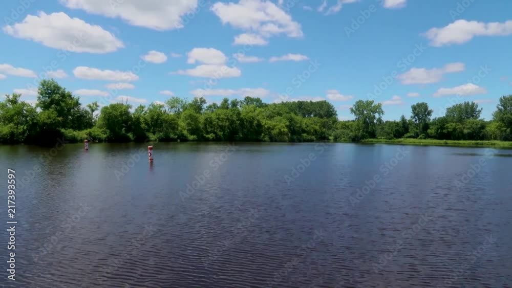 Time lapse of the clouds passing over a reservoir, reflecting back up to the sky. Time lapse of the clouds passing over a reservoir, reflecting back up to the sky.
