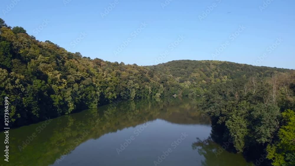 Aerial view on calm river in middle of forest Aerial view on calm river in middle of forest