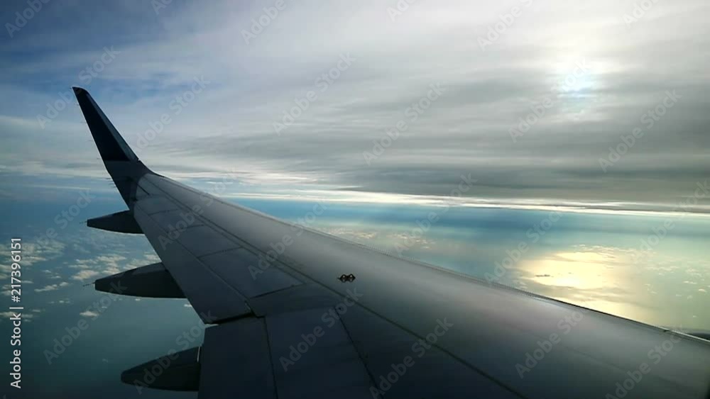 airplane fly below clouds with misty sunshine airplane fly below clouds with misty sunshine