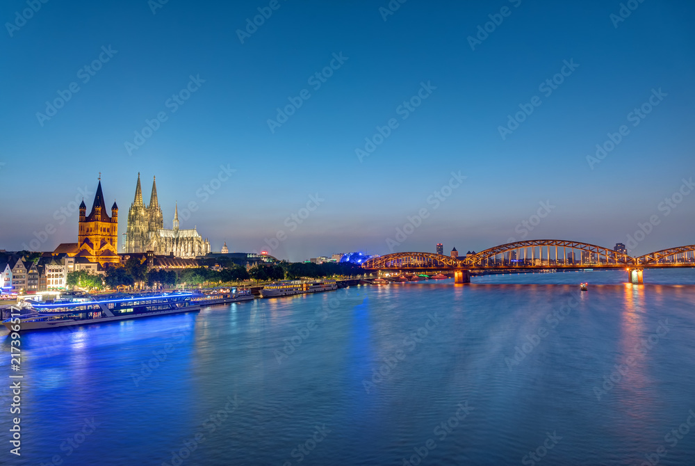 The famous skyline of Cologne with the cathedral at dusk