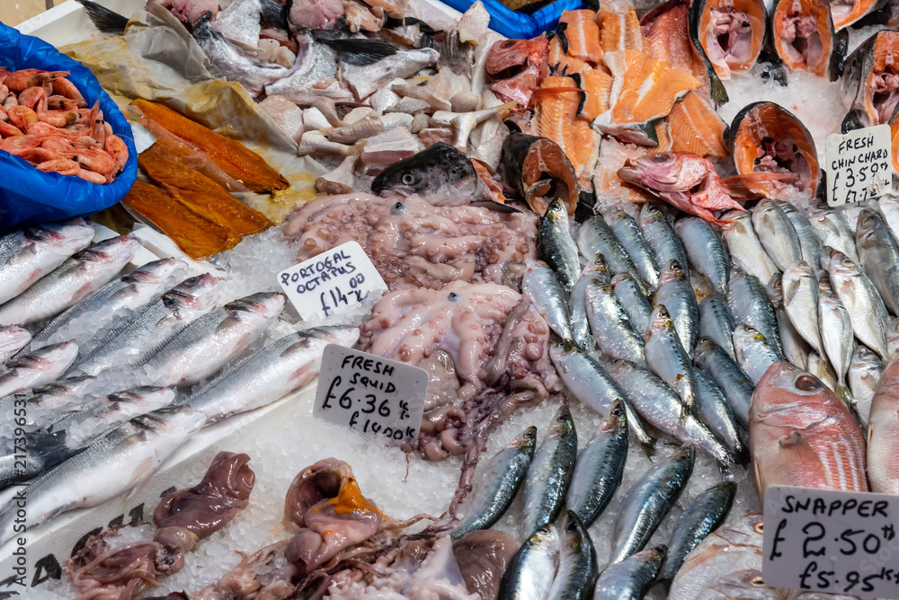 Fish and seafood for sale at a market in London, UK StockFoto Adobe