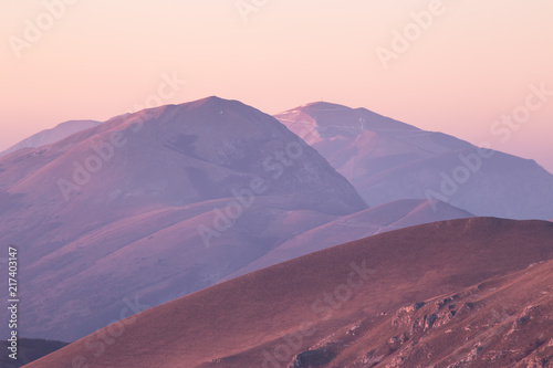 A view of some mountains top  with beautiful  warm sunset colors