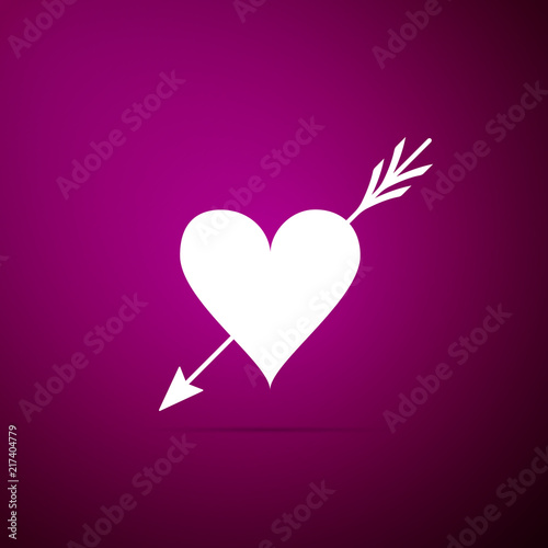 Amour symbol with heart and arrow icon isolated on purple background. Love sign. Valentines symbol. Flat design. Vector Illustration © mingirov
