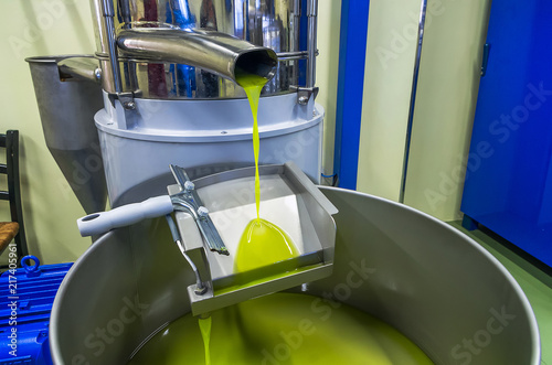 Slika na platnu fresh oil flowing in the bin after processing at the mill