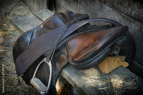 Old leather saddle for riding a horse, close up