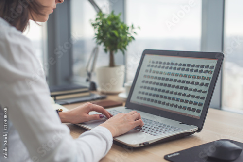 Businesswoman typing on laptop at workplace Woman working in office hand keyboard