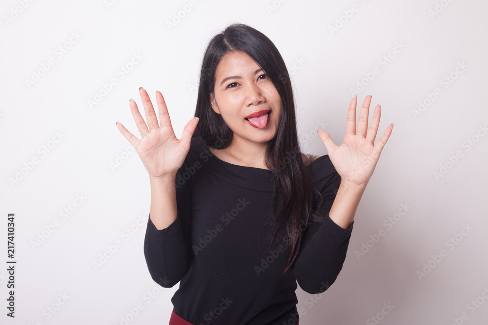 Young Asian woman sticking her tongue out. Young Asian woman sticking her tongue out.