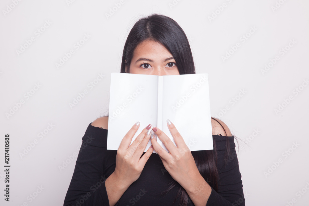 Young Asian woman with a book. Young Asian woman with a book.