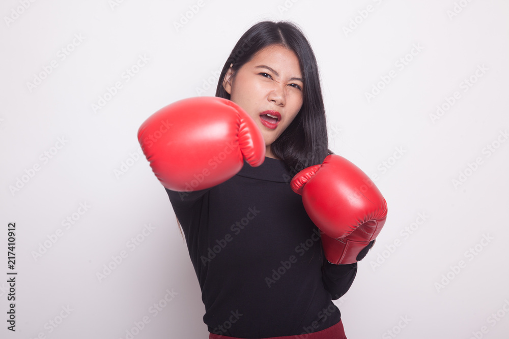 Young Asian woman with red boxing gloves. Young Asian woman with red boxing gloves.
