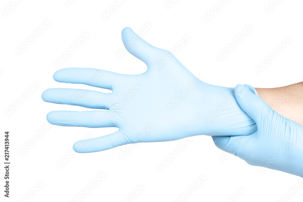 Doctor putting on blue sterilised medical glove for making operation