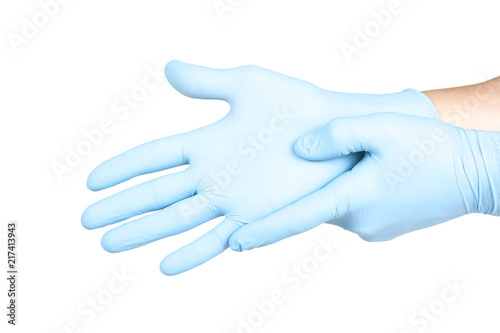 Fototapeta Naklejka Na Ścianę i Meble -  Doctor putting on blue sterilised medical glove for making operation