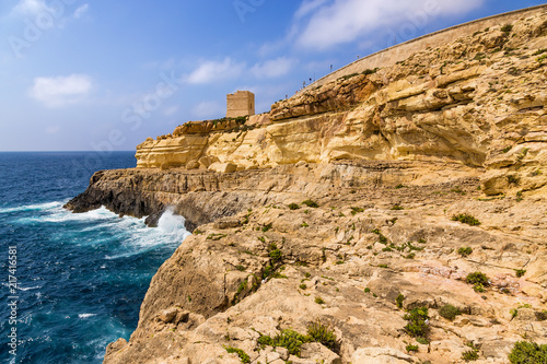 Wied Iz-Zurrieq, Malta. Scenic view with an old watchtower (1638) on a rocky shore