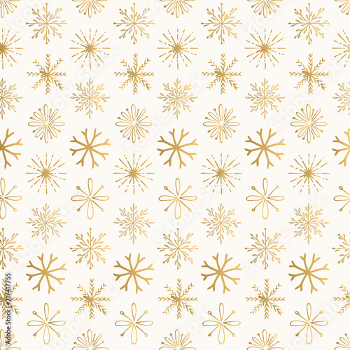Golden Christmas pattern with creative hand drawn snowflakes. Vintage decorative design.
