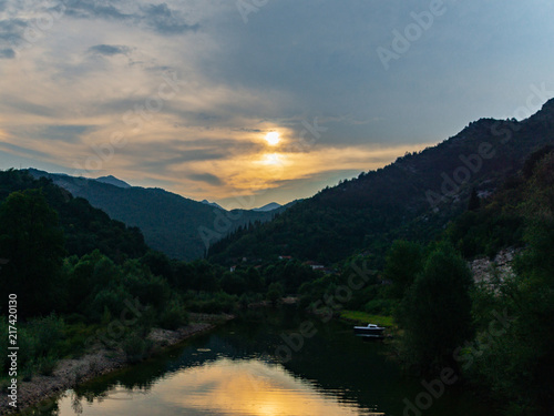 Sunset above the river in the mountains