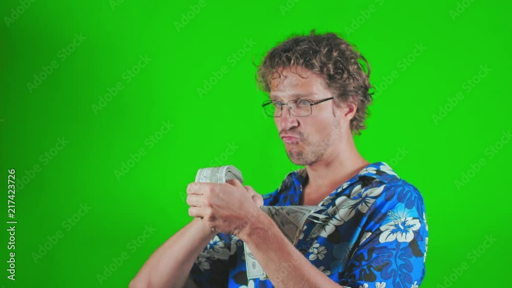 Disheveled freelancer showing money with smile and ready to go a vacation Disheveled freelancer showing money with smile and ready to go a vacation