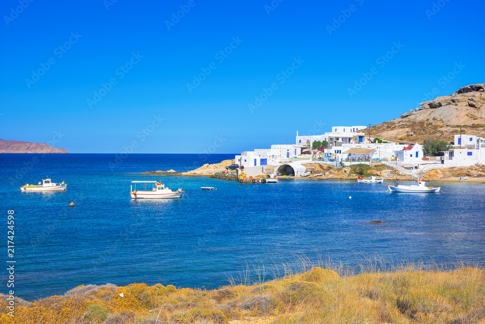 Beautiful small village at Kalafati beach with octopus drying in the sun, Mykonos island, Greece.