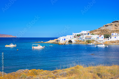 Beautiful small village at Kalafati beach with octopus drying in the sun, Mykonos island, Greece. photo