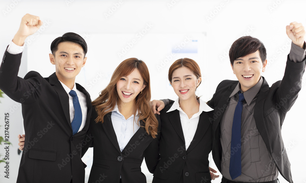 happy young business team in office happy young business team in office
