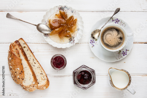 Breakfast with coffee on old rural table.