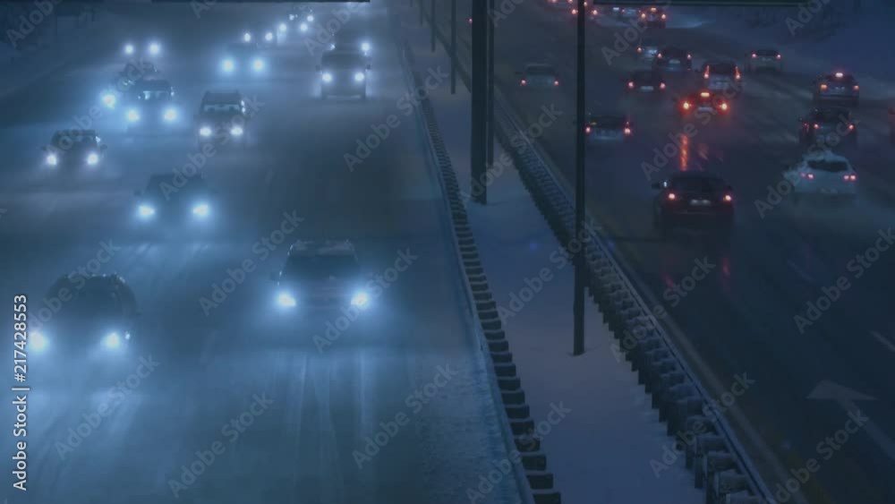 High angle shot on the busy, snowy highway. High angle shot on the busy, snowy highway.