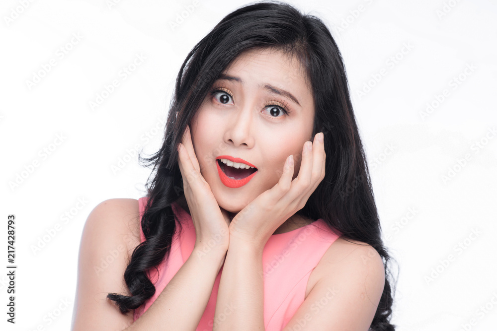 Surprised face of young asian woman over white. Surprised face of young asian woman over white.