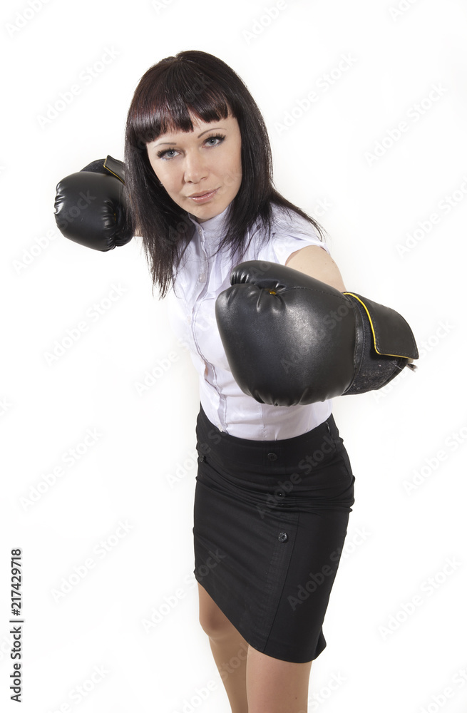 Business woman in boxing gloves