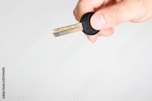 key in hand on a light background © sergeylapin
