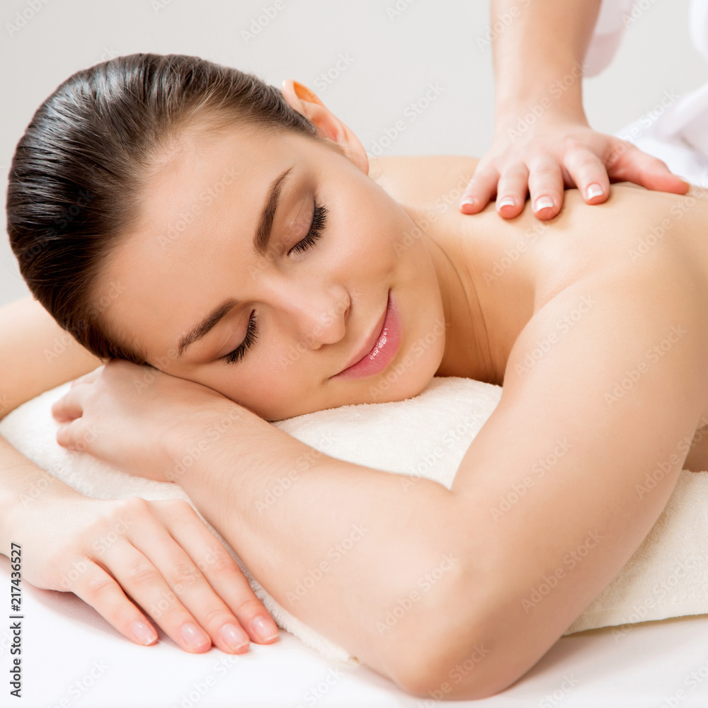 Beautiful woman on a body massage