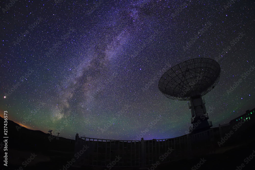 radio telescope on the background of stellar tracks radio telescope on the background of stellar tracks