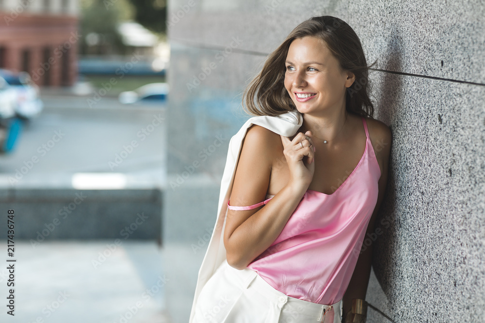 Young attractive woman outdoors smiling