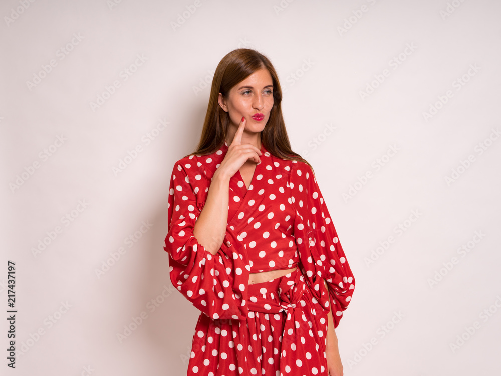 female Model Against white Studio Background in red dress female Model Against white Studio Background in red dress