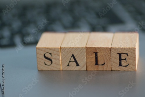 Illustration Growth written on wooden blocks with blurred note pc background