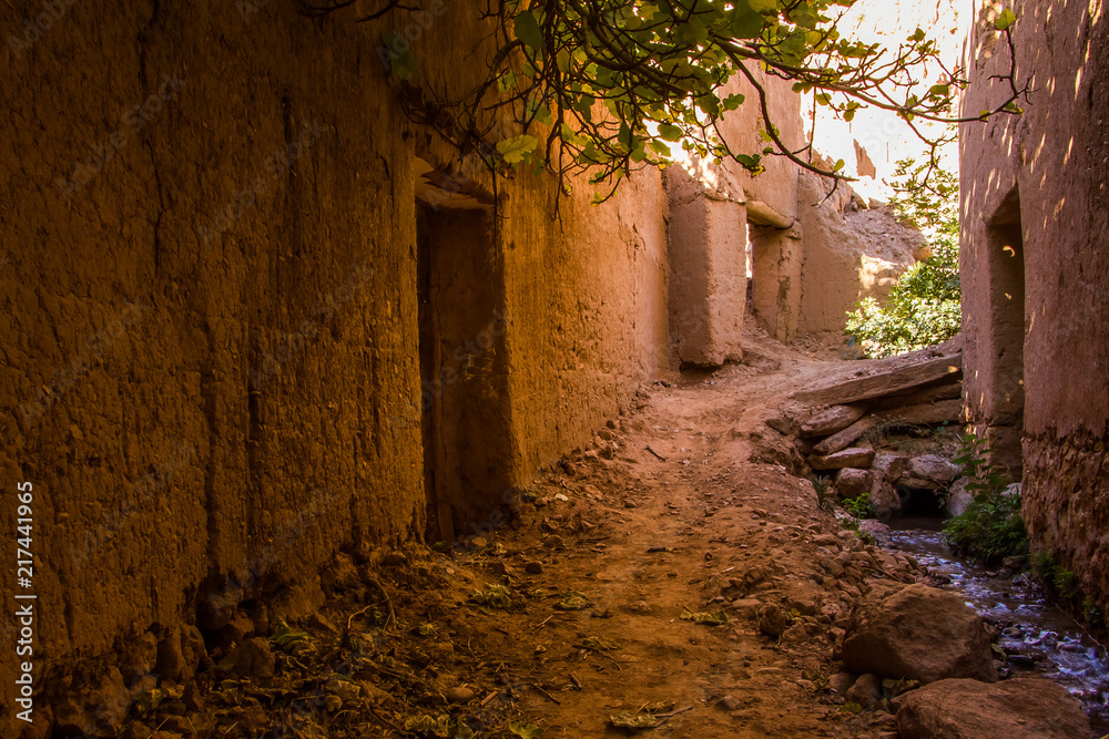The ancient moroccan town near Tinghir with old kasbahs and high Atlas mountains in background, Tinghir, Morocco in Africa The ancient moroccan town near Tinghir with old kasbahs and high Atlas mountains in background, Tinghir, Morocco in Africa