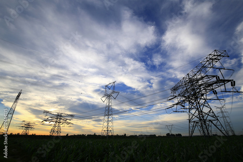 High voltage tower in the background of sunset