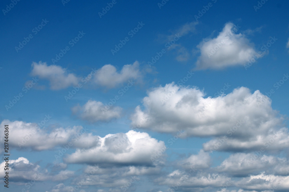  white clouds against blue sky for background closeup